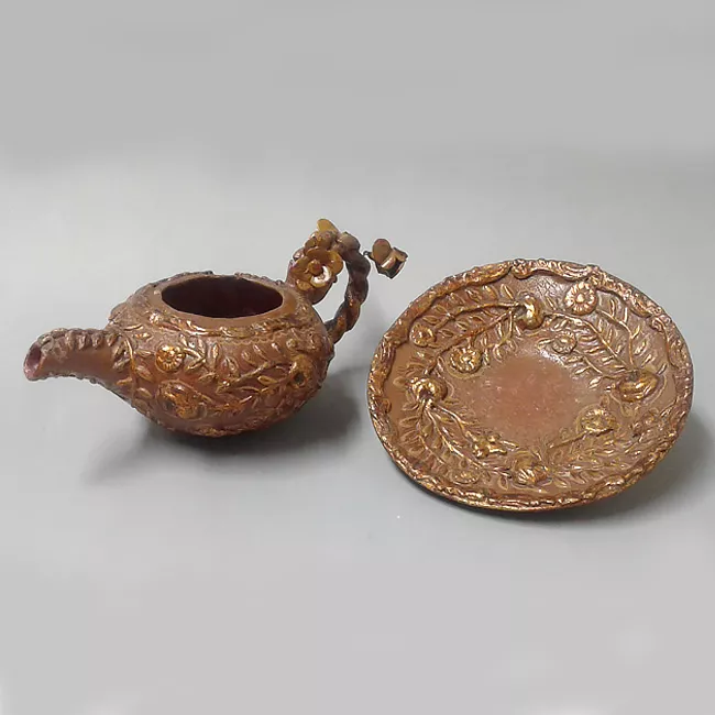 Tetera y plato