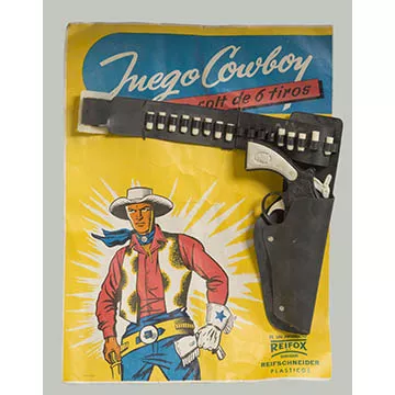 Revólver con cinturón y balas